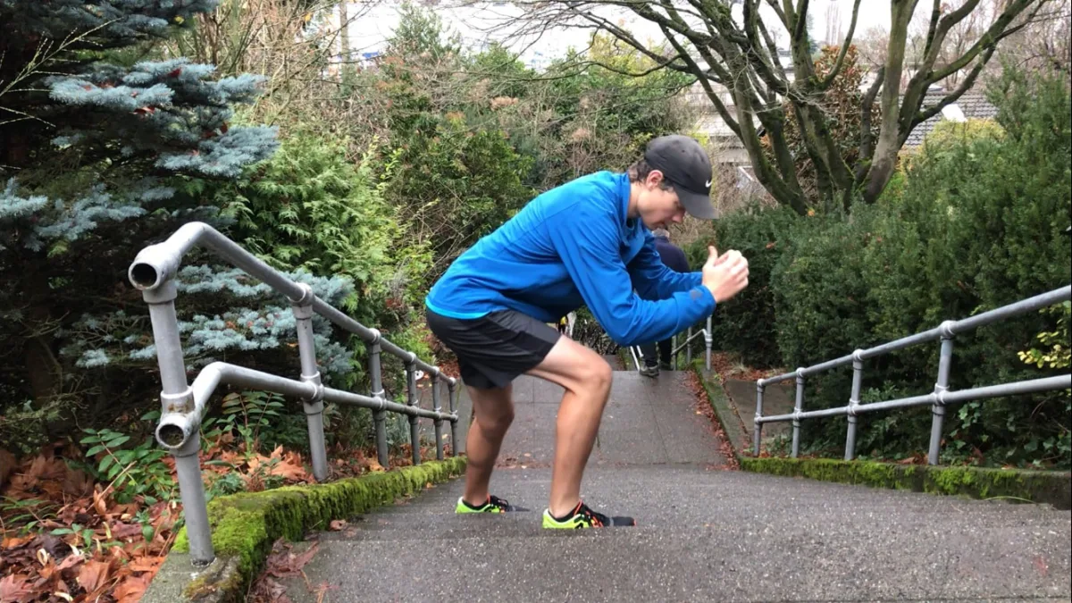 Dan performing a lateral lunge on a staircase
