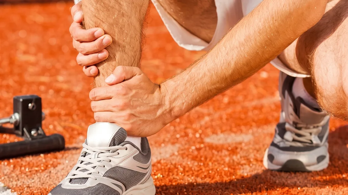 Physical therapist working with an athlete on sports rehabilitation
