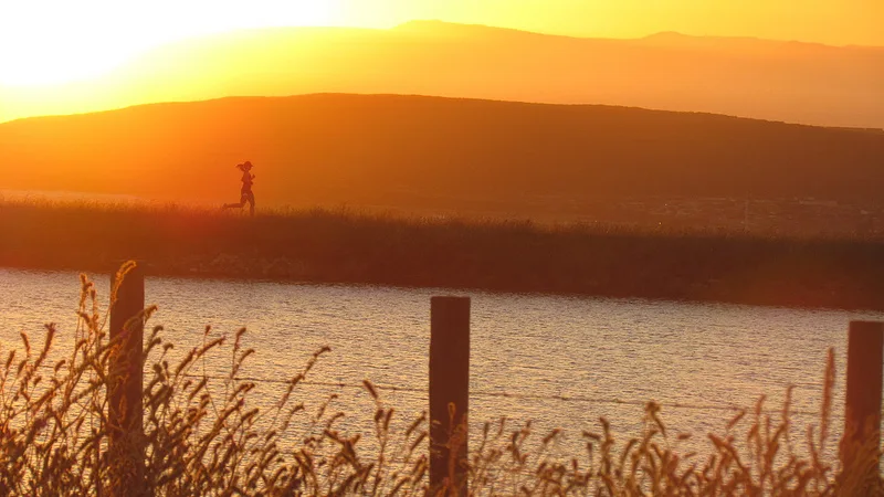 A runner training outdoors during the off-season