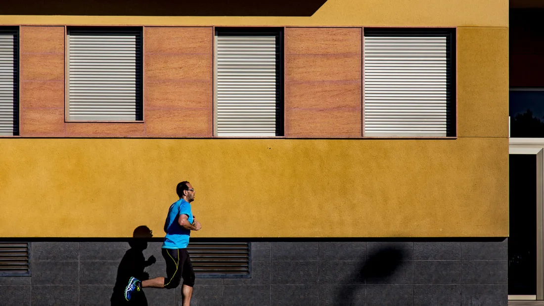 A runner in mid-stride outdoors