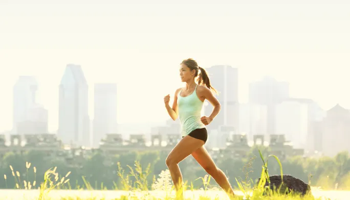 Physical therapist assessing a runner's gait and lower leg mechanics