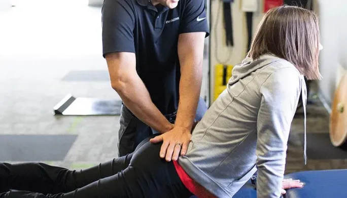 Doctor of Physical Therapy performing hands-on manual therapy